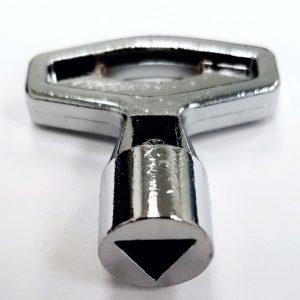 An image of our triangle-shaped replacement key from Crown Products bag dispensers.